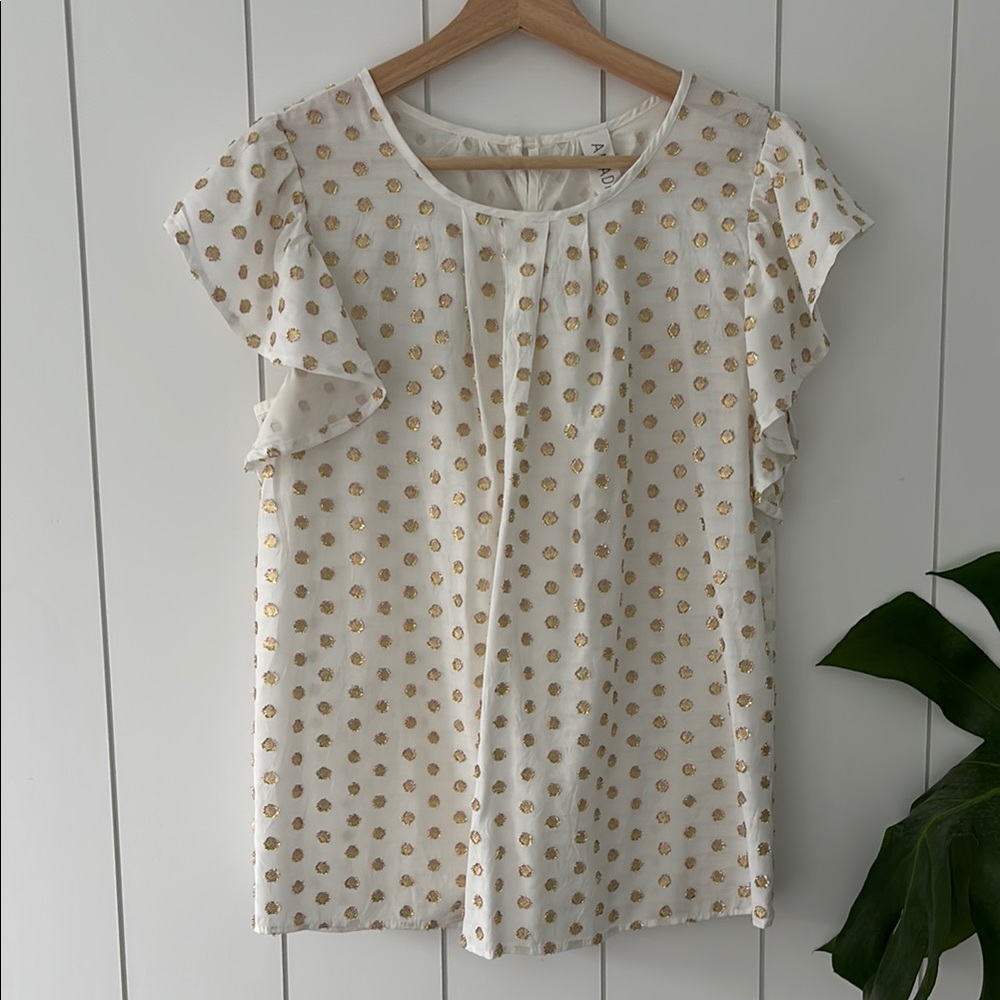 Cream flutter sleeve top.